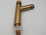 a close up of a brass pipe on a white surface