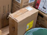 many boxes stacked on top of each other in a pile