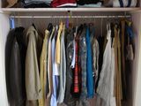 a closet with a lot of clothes and shoes on it