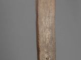 an image of a tall wooden object on a metal stand