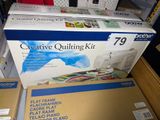 a box of creative quilting kit sitting on a table