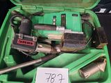 a green box with tools in it and a price tag on it