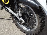 a close up of a motorcycle parked on the side of the road