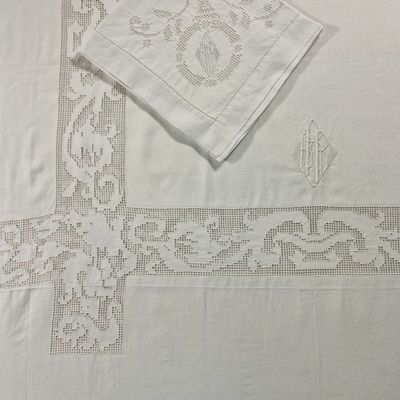 a white table cloth with a cross design on it