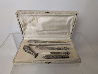 a silver case with a set of tools inside of it