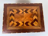 an image of a wooden box with a geometric design on it