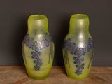 two vases that are sitting on a table