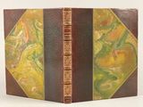an old book with a brown cover and a yellow and green cover