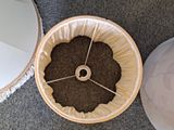 a coffee filterer sitting on the floor next to a mirror