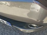 a close up of a car ' s bumper with a number plate on it