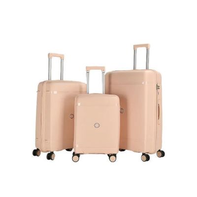 three pieces of luggage sitting on top of each other on a white surface