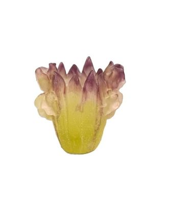 a yellow vase with a purple flower inside of it
