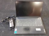 a laptop that is sitting on the floor with a charger