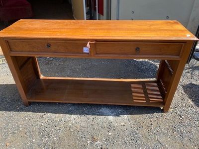 a wooden table with a drawer on top of it