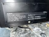 a close up of a black laptop computer on a table