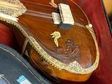 a guitar in a case that is sitting on top of a table