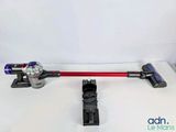 two different types of corded vacuums on a table