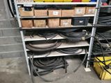 a rack with many different types of hoses on it