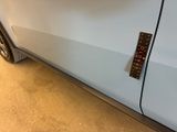a sticker on the door of a car that has a remote control attached to it
