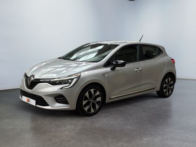 a silver car is parked in a room with a white wall