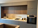 an image of a kitchen with a sink and a stove