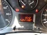 a digital clock on the dashboard of a car