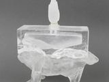 an ice sculpture of a horse with a bird on top of it