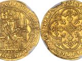 a gold coin with an image of a man on it