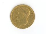 a gold coin with a picture of a woman on it