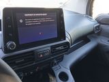 the interior of a car with a tablet on the dashboard
