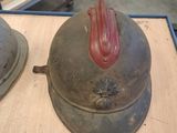 three hats sitting on a table with pictures in the background