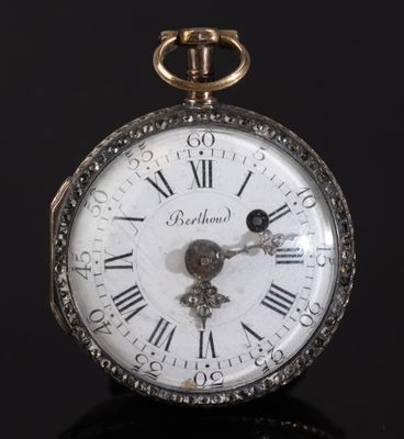 an antique pocket watch with roman numerals and roman numerals on the face