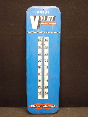 un thermomètre bleu posé sur une table