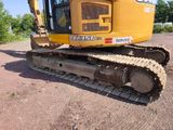 a yellow bulldozer that is parked in the dirt