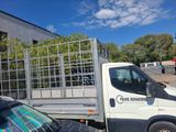 a white truck that is parked in front of a building