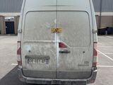 a white van that is parked in a parking lot