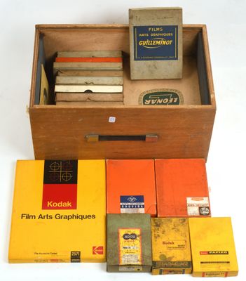 a wooden box filled with books and a few other items