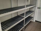 a room with a bunch of shelves that have bottles on them