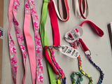 a lot of lanyards and leashes on the table