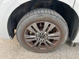 a white car that has a flat tire on it