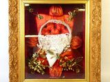 tableau encadré représentant un panier de fleurs contenant un cœur