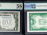 trois types différents de billets exposés dans une vitrine