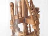 a wooden structure with a ladder inside of it