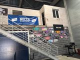 a metal staircase going up to a building with a sign on it