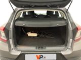 the back of a car with the trunk open and a laptop in the trunk