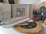 a picture of a fan and a picture frame on a table