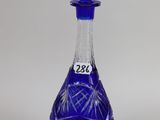 an image of a blue glass bottle with a star of david on it