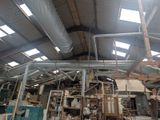 a large room with a lot of pipes and a ceiling
