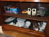 a wooden cabinet with a bunch of plates and bowls on it