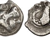 a close up of a silver coin with a bird on it